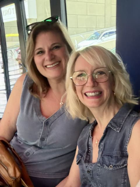Smiling women at travel agency, travel advisors, friendly service.